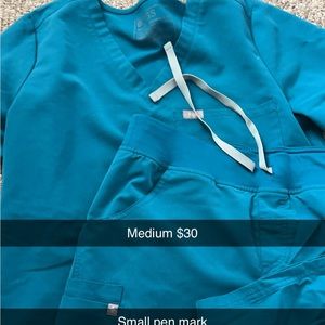 Medium petite top and bottom set. Small pen mark